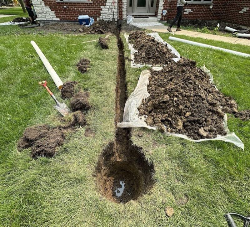 Downspout extension in process